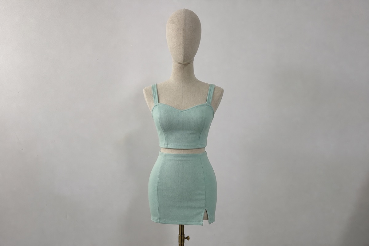 Mint green women's two-piece set on mannequin for co-ord manufacturing